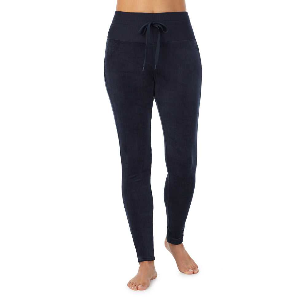 A lady wearing blue stretch velour legging