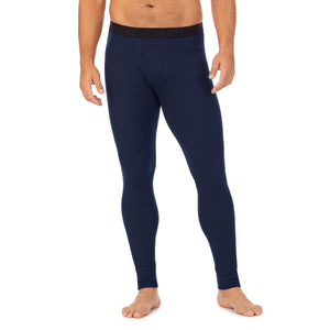 A man wearing navy blazer waffle thermal pant.