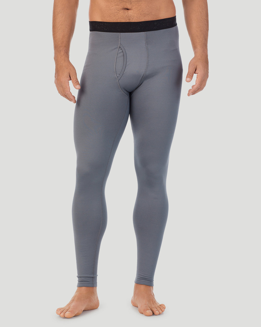 A man wearing nickel grey arcticore pant.