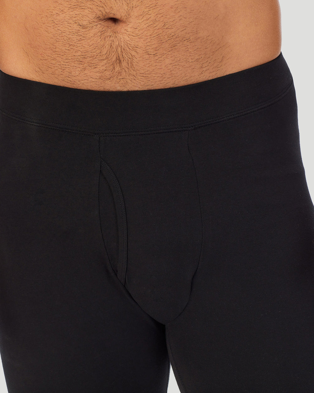 A man wearing a black cottonwear pant