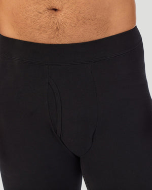 A man wearing a black cottonwear pant