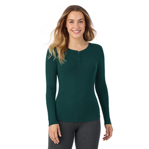  A lady is wearing a Dark Pine Stretch Rib Long Sleeve Henley