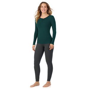 A lady is wearing a Dark Pine Stretch Rib Long Sleeve Henley