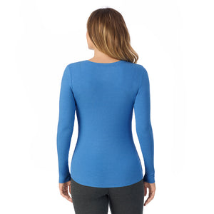  A lady is wearing a Blue Comet Stretch Rib Long Sleeve Henley
