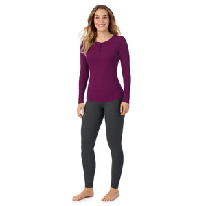  A lady is wearing a Dark Purple Stretch Rib Long Sleeve Henley