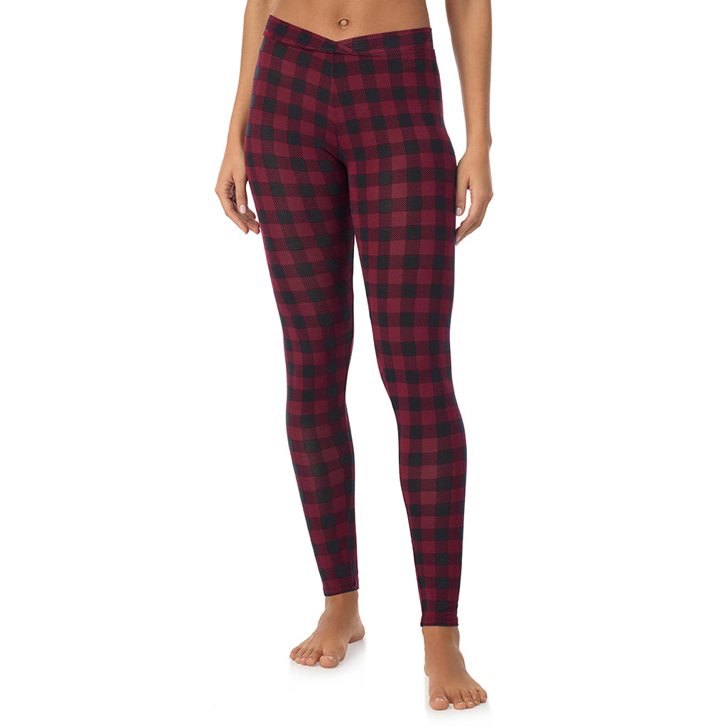 A lady wearing a cabernate buffalo check stretch legging.