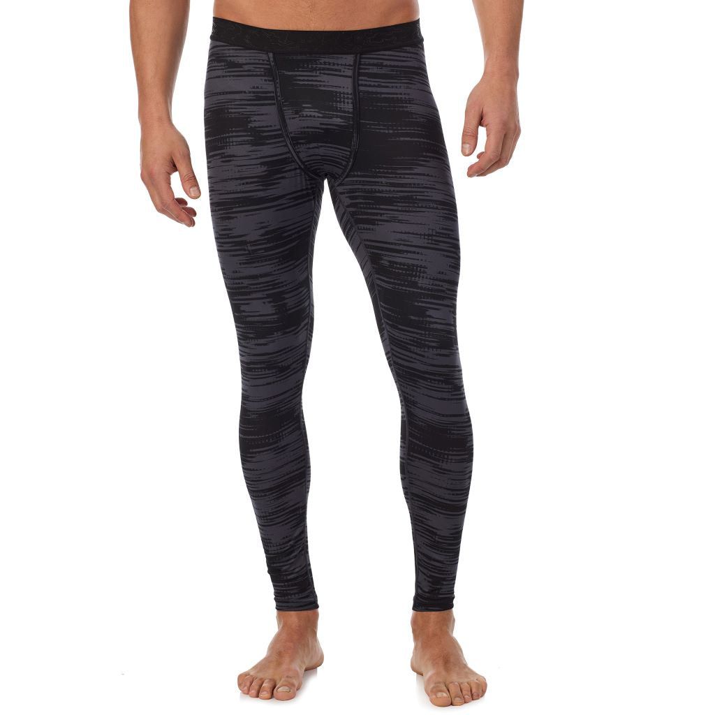 Black Allover Print; Model is wearing a size M. He is 6’2”, Waist is 32”, Inseam 34”.@Lower body of a man wearing black allover print climatesport pants !88% Recycled Polyester, 12% Spandex!