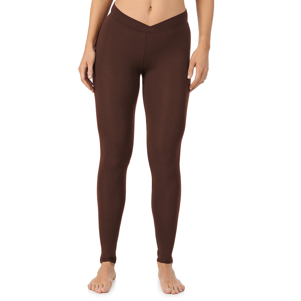 A lady wearing a deep mahogany stretch legging.