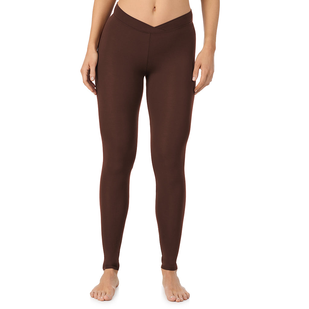 A lady wearing a deep mahogany stretch legging.