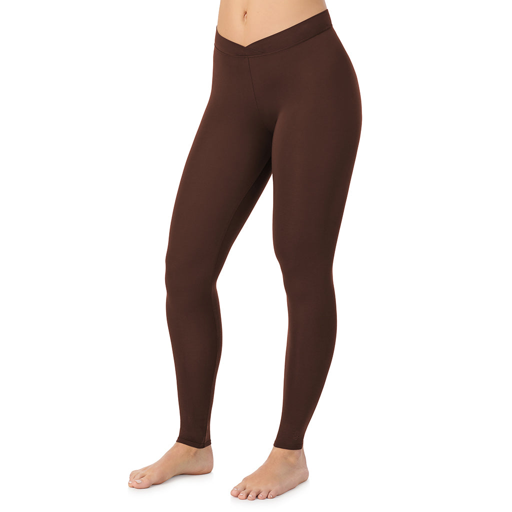 A lady wearing a deep mahogany stretch legging.