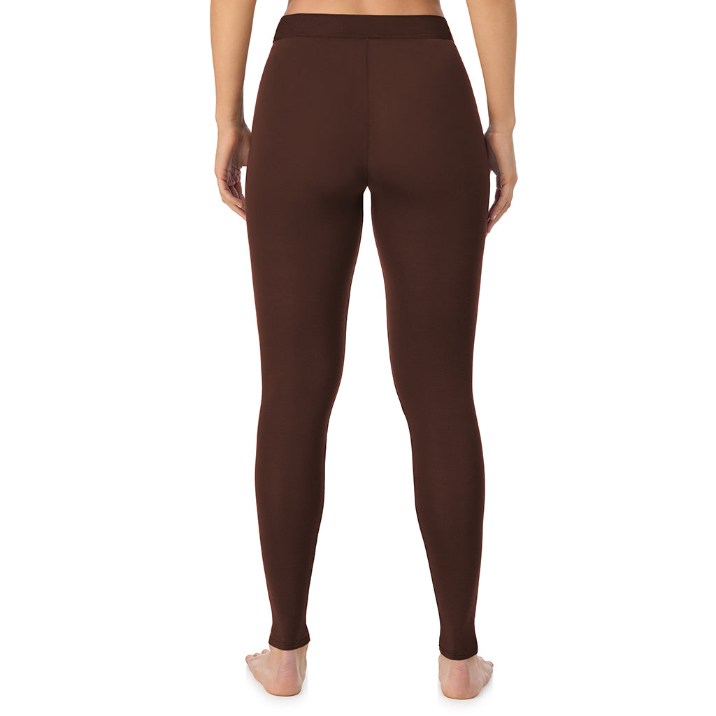 A lady wearing a deep mahogany stretch legging.