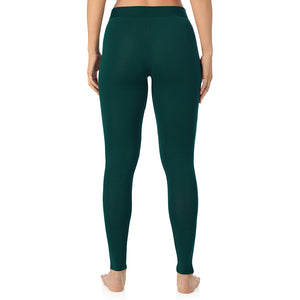 A lady wearing a dark pine stretch legging.