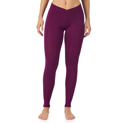Dark Purple; Model is wearing size S. She is 5'11.5", Bust 34", Waist 26", Hips 37". @A lady wearing a dark purple stretch legging.