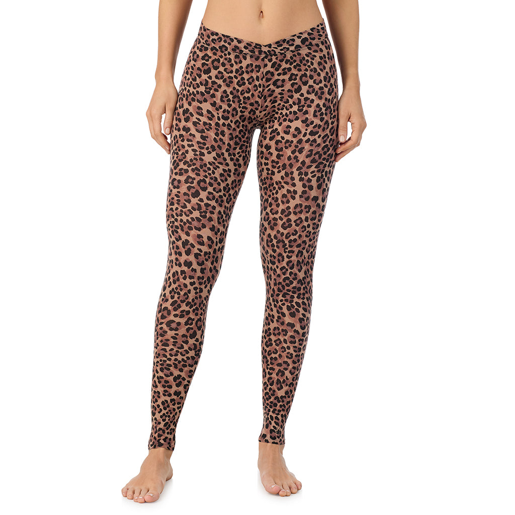 A lady wearing a taupe leopard stretch legging.