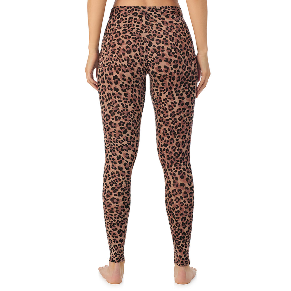 A lady wearing a taupe leopard stretch legging.
