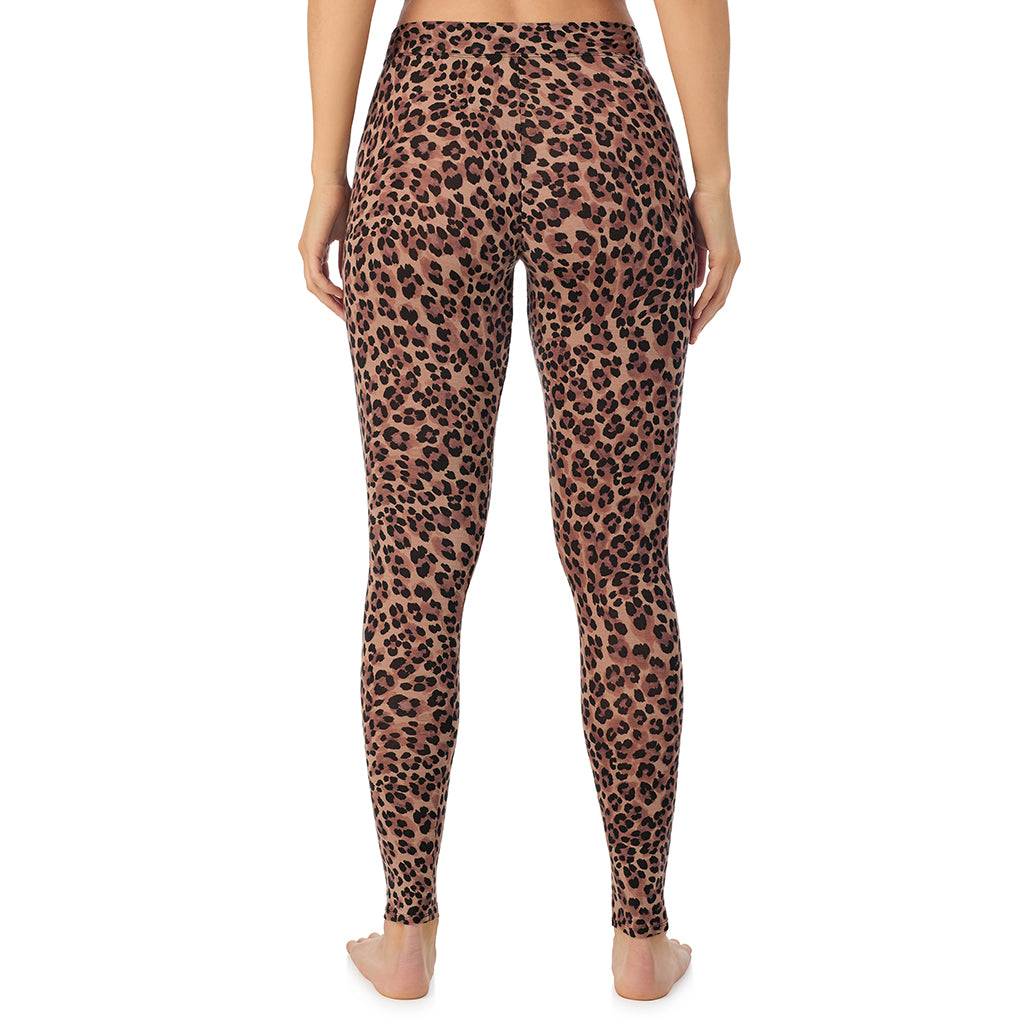 A lady wearing a taupe leopard stretch legging.