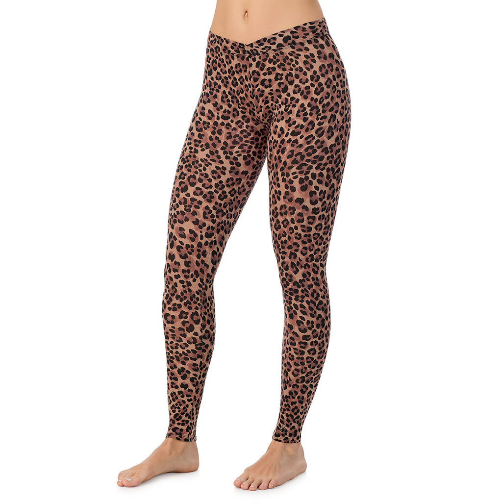 A lady wearing a taupe leopard stretch legging.