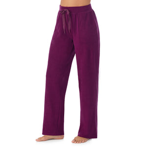 A lady wearing Dark Purple fleecewear with stretch lounge pant.!94% Recycled Polyester, 6% Spandex!