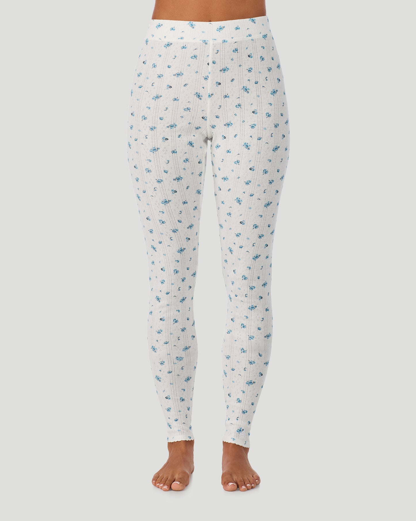 Blue Ditsy; Model is wearing a size S. She is 5’7”, Bust 32”, Waist 25”, Hips 34”. @A lady is wearing Blue Ditsy Cotton Pointelle Legging in a front view look