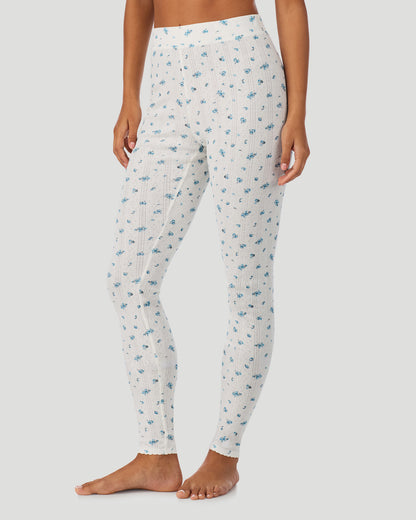 A lady is wearing Blue Ditsy Cotton Pointelle Legging in a front view  side angle look
