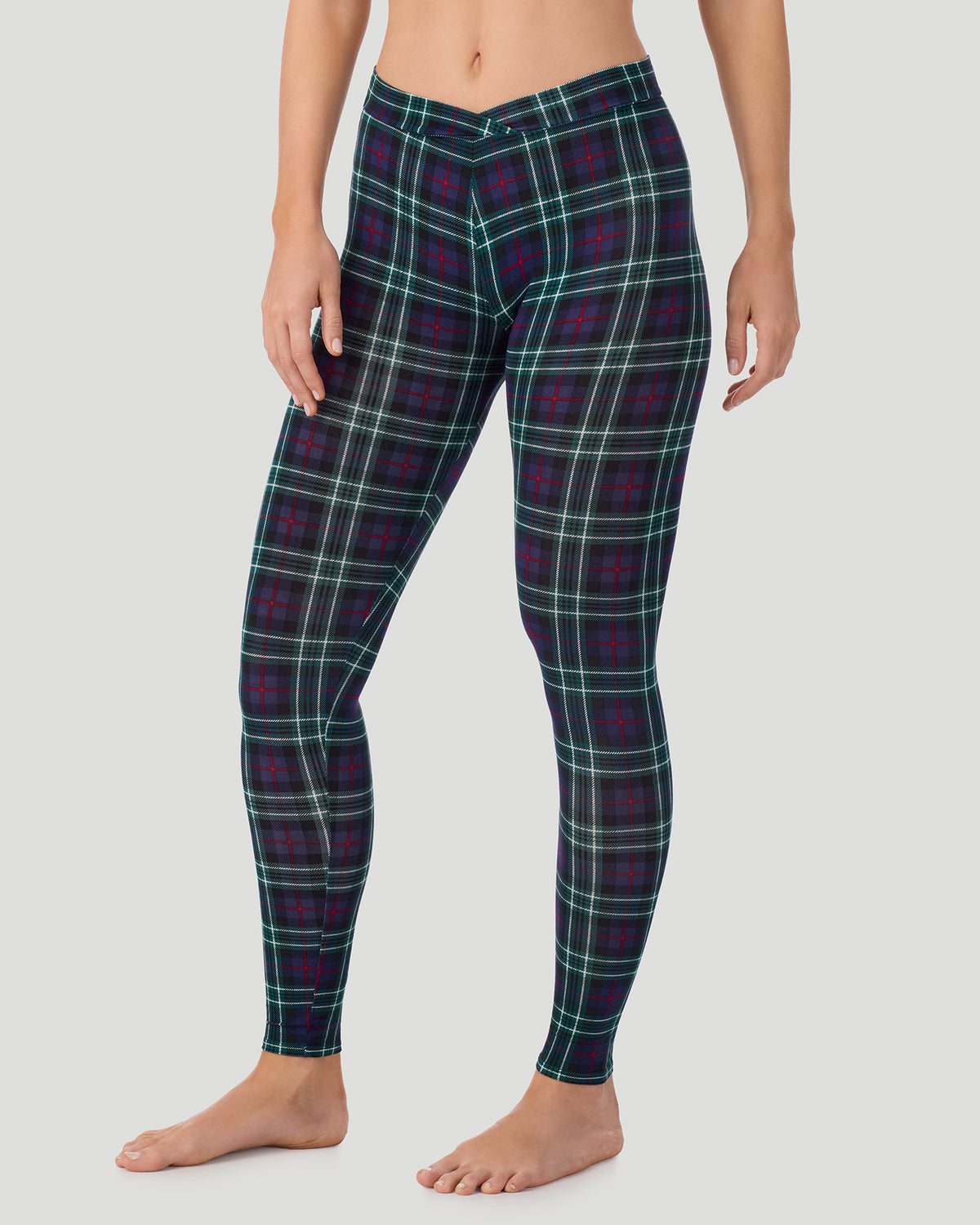 Blackwatch Plaid; Model is wearing a size S. She is 5’11.5”, Bust 34”, Waist 27”, Hips 38.5”.  @ A lady wearing a Blackwatch Plaid Softwear With Stretch Legging in a side angle pose