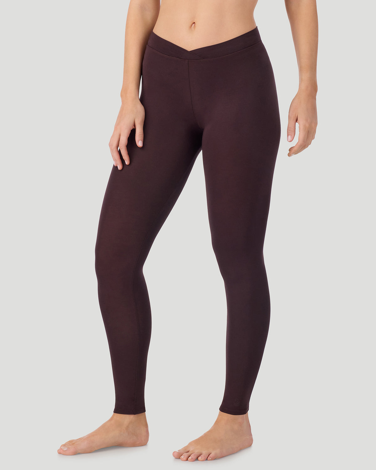  A lady wearing a Mahogany Softwear With Stretch Legging in a front view side angle pose
