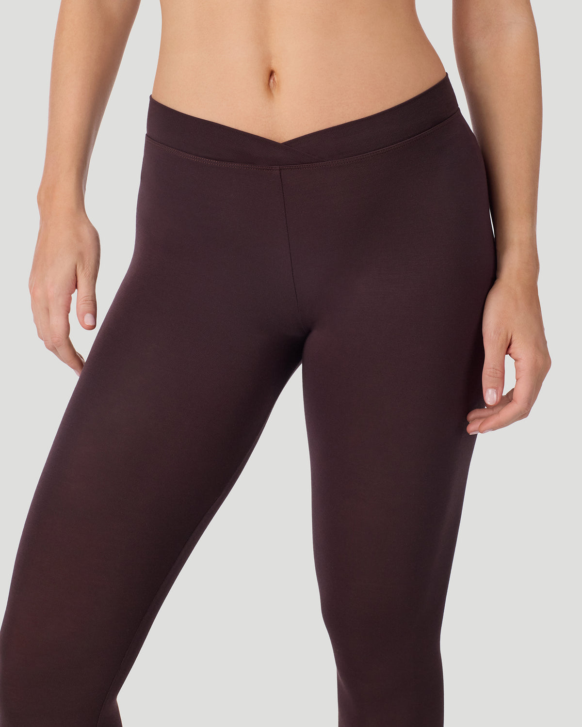 Mahogany; Model is wearing a size S. She is 5’11.5”, Bust 34”, Waist 27”, Hips 38.5”.  @ A lady wearing a Mahogany Softwear With Stretch Legging in a front view close up look