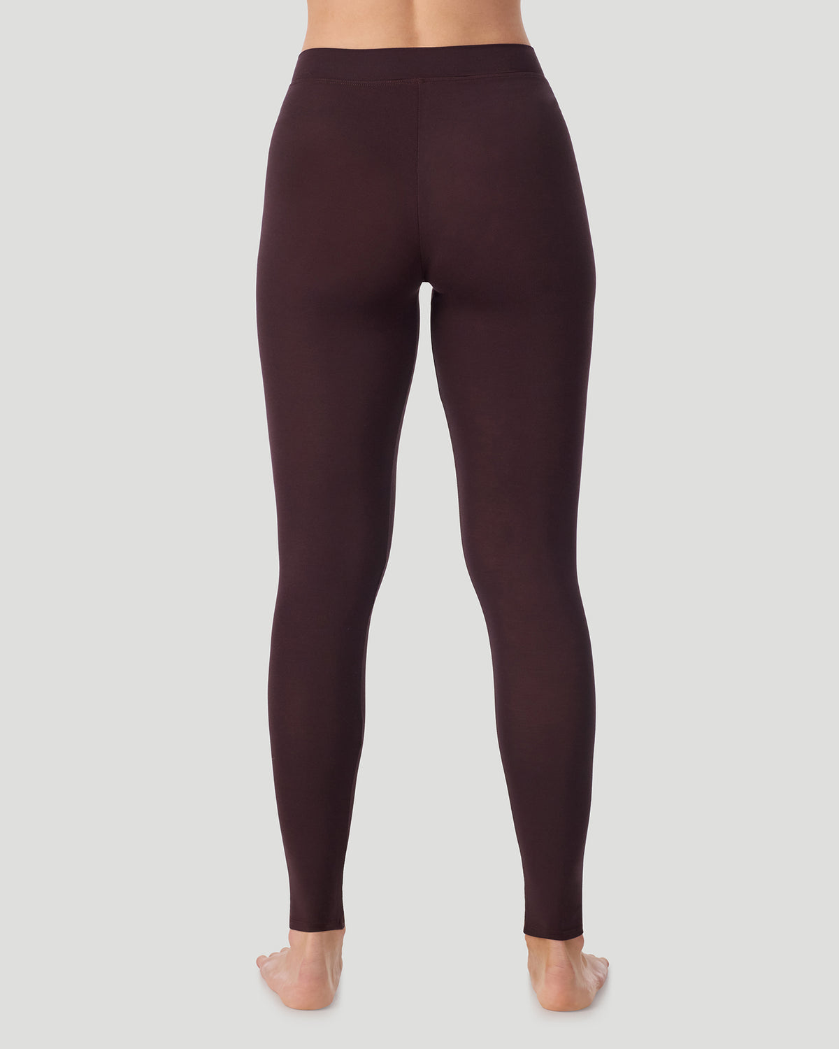 Mahogany; Model is wearing a size S. She is 5’11.5”, Bust 34”, Waist 27”, Hips 38.5”.  @ A lady wearing a Mahogany Softwear With Stretch Legging in a back view pose