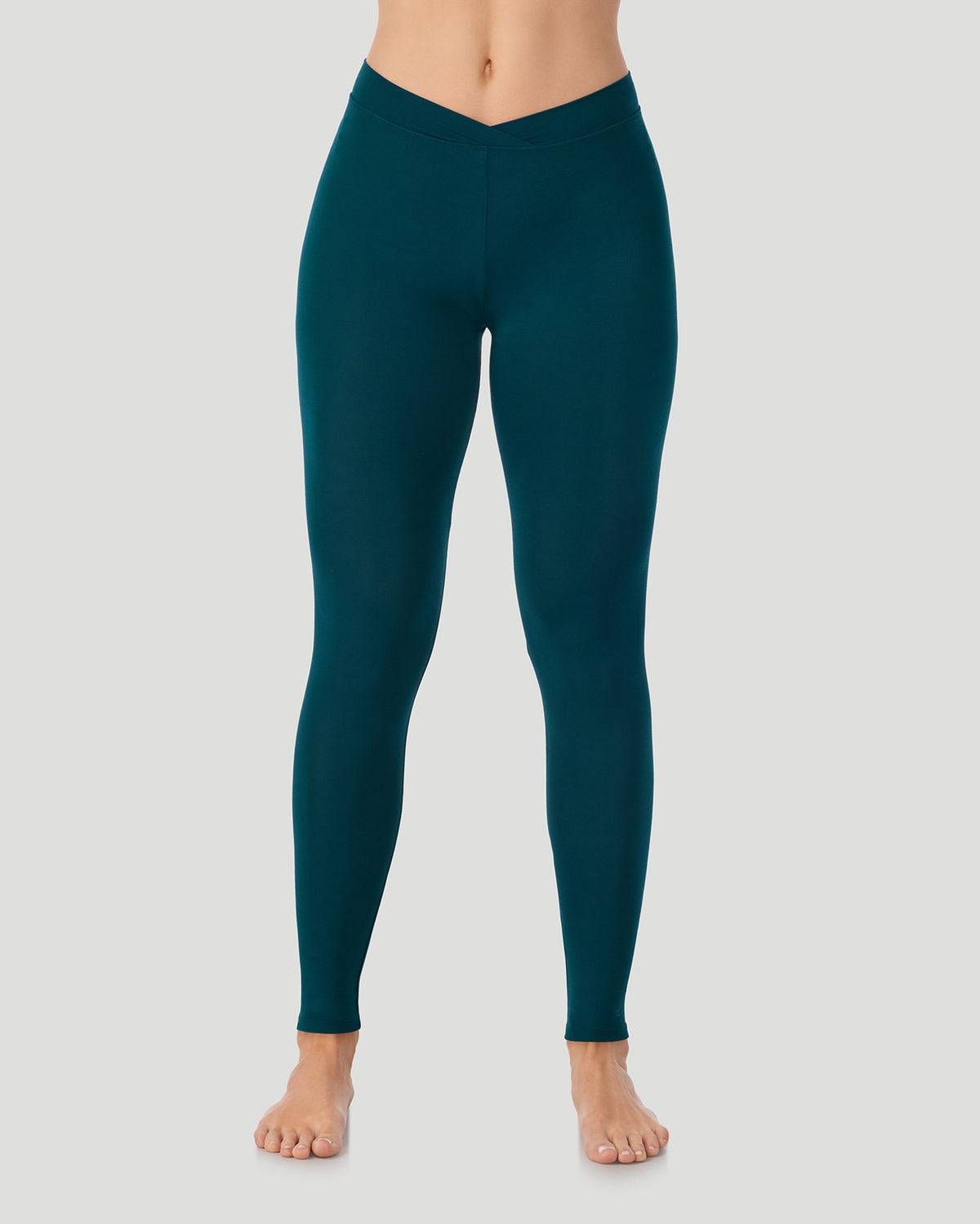  A lady wearing a Deep Emerald Softwear With Stretch Legging in a front view pose