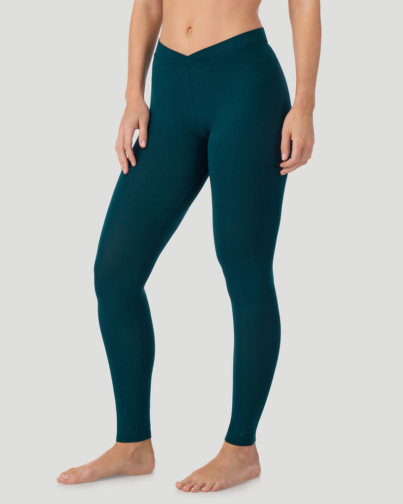  A lady wearing a Deep Emerald Softwear With Stretch Legging in a front view side angle pose
