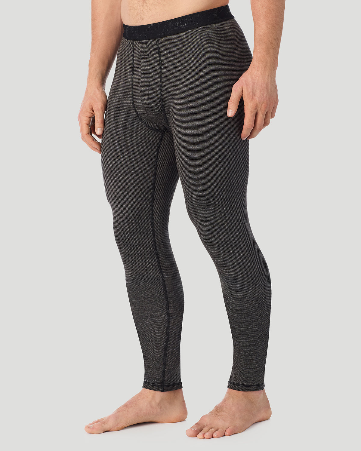  A man wearing Grey Stripe FlexStripe Pant in a side view pose