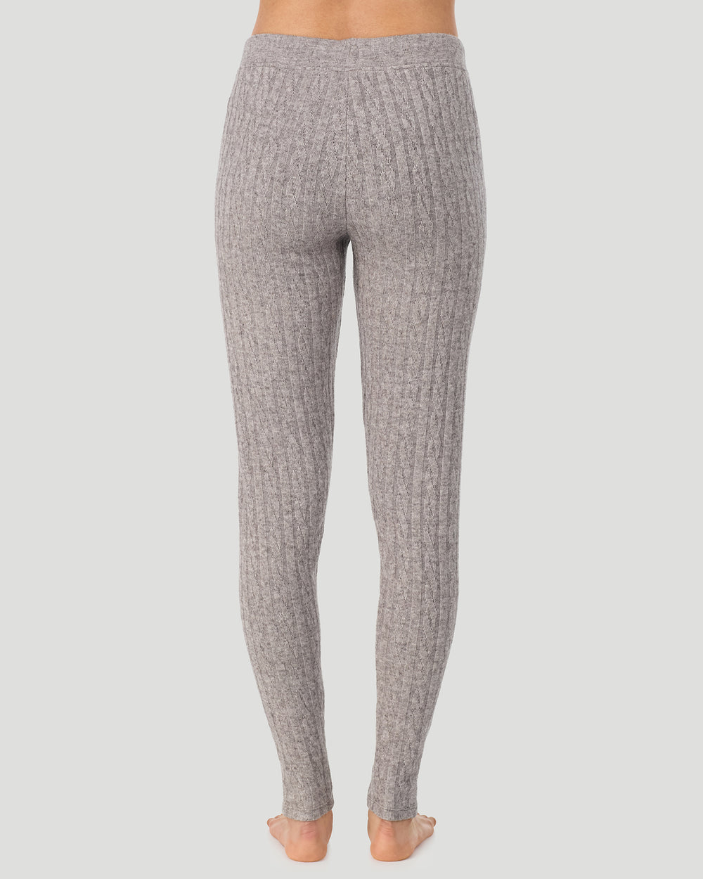 A lady wearing Light Grey Heather Cable Knit Legging in a back view pose