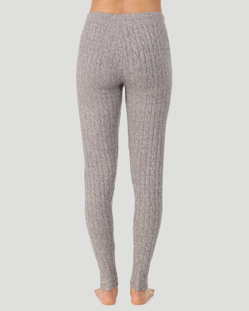 A lady wearing Light Grey Heather Cable Knit Legging in a back view pose