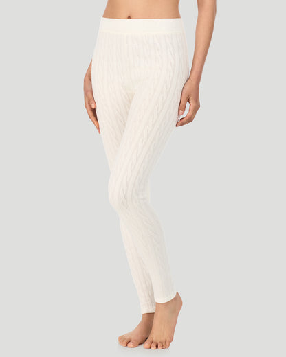 A lady wearing Vanilla Ice Cable Knit Legging in a front view side angle pose