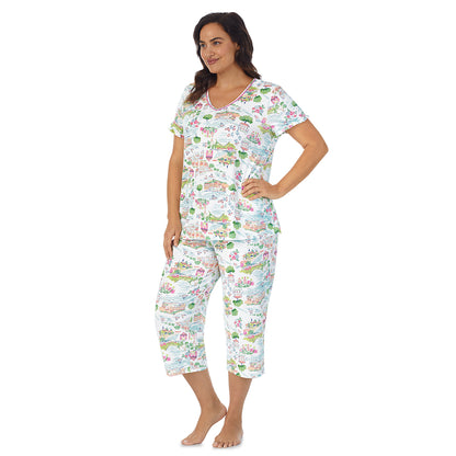 White Scenery;Model is wearing size 1X. She is 5'11.5", Bust 41", Waist 33", Hips 46"@A lady wearing white short sleeve top with cropped pant pajama set with white scenery print