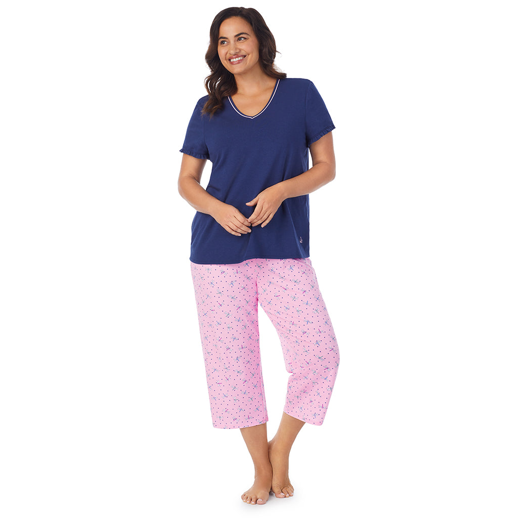 Pink Dragonfly;Model is wearing size 1X. She is 5'11.5", Bust 41", Waist 33", Hips 46"@A lady wearing short sleeve top with cropped pant pajama set with pink dragonfly print