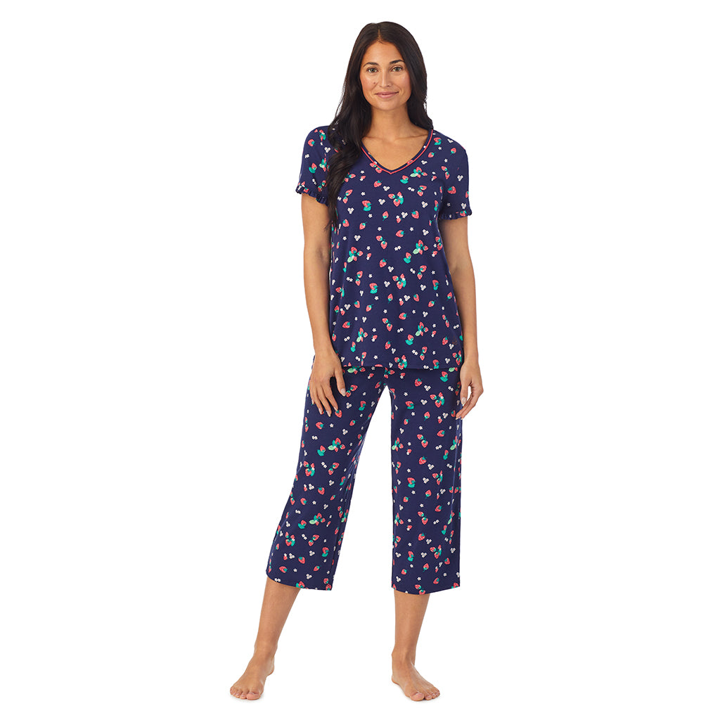 Strawberry Field; Model is wearing size S. She is 5'8.5", Bust 32", Waist 25", Hips 36". @A lady wearing short sleeve top with cropped pant pajama set with Strawberry Field print