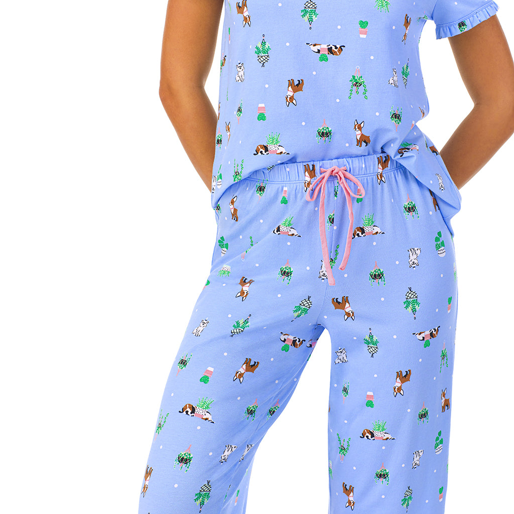 Succulent Dogs; Model is wearing size S. She is 5'8.5", Bust 32", Waist 25", Hips 36". @A lady wearing short sleeve top with cropped pant pajama set with Succulent Dogs print