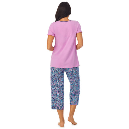 Multi Animal; Model is wearing size S. She is 5'8.5", Bust 32", Waist 25", Hips 36". @A lady wearing pink short sleeve top with cropped pant pajama set with Multi Animal print