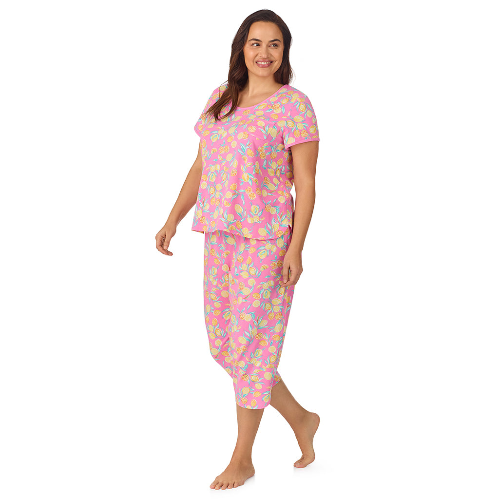 Lemon; Model is wearing size 1X. She is 5'11.5", Bust 41", Waist 33", Hips 46" @A lady wearing pink short sleeve top with cropped pant pajama set with lemon print