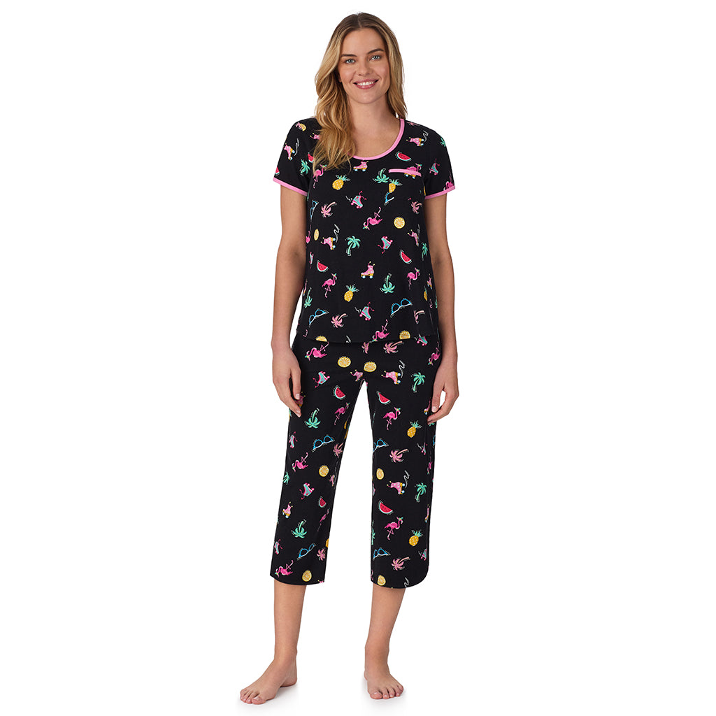 Summer Graphic;Model is wearing size S. She is 5’10”, Bust 34”, Waist 26", Hips 38”. @ A lady wearing black short sleeve top with cropped pant pajama set with Summer Graphic print