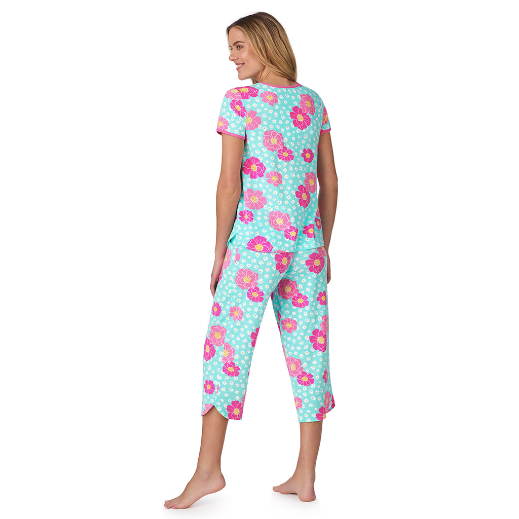 Aqua Multi Floral;Model is wearing size S. She is 5’10”, Bust 34”, Waist 26", Hips 38”. @ A lady wearing blue short sleeve top with cropped pant pajama set with floral print