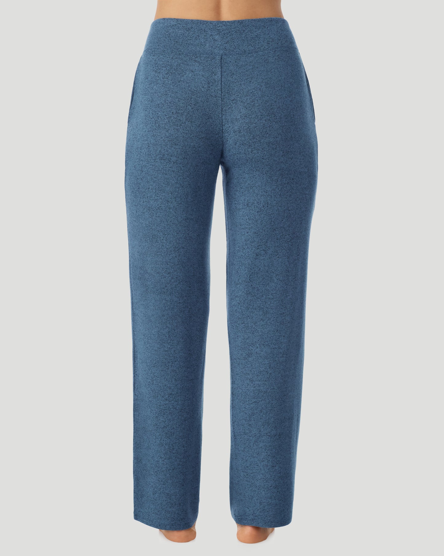 Deep Chambray; Model is wearing a size S. She is 5’9.5”, Bust 34”, Waist 25”, Hips 36.5”. @ A lady wearing Deep Chambray SoftKnit Lounge Pant in a back view pose