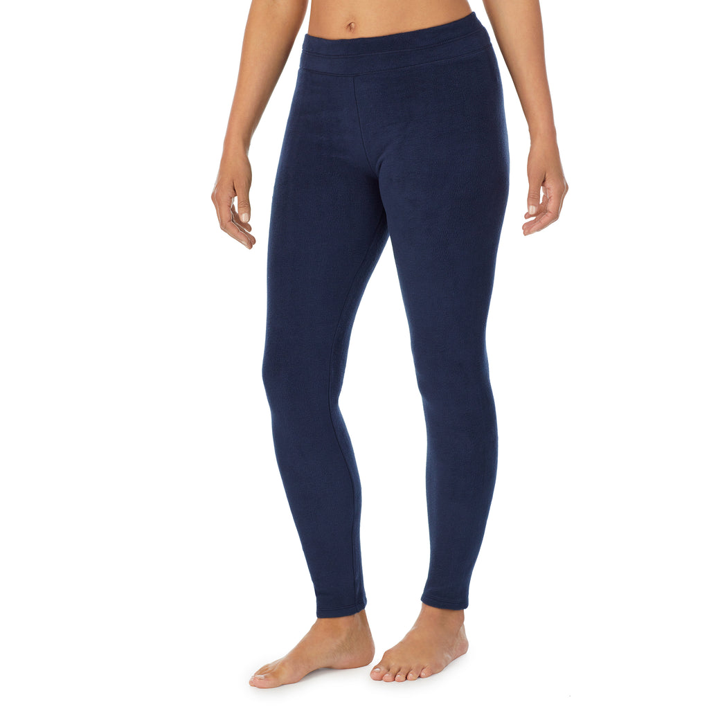 A lady wearing navy blazer fleecewear with stretch legging.