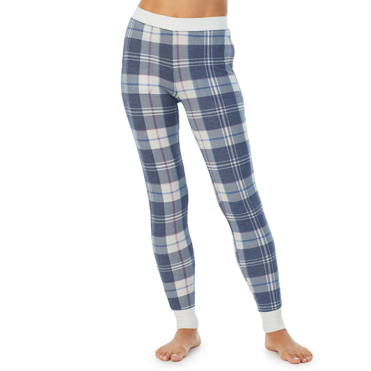 A lady wearing a Blue Plaid legging.