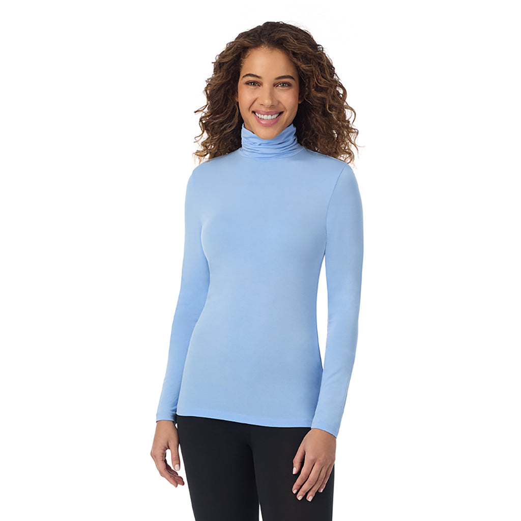 A lady wearing ultramarine long sleeve vista blue softwear with stretch top.