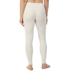 A lady wearing Cozy Stretch Thermal Legging in Ivory side view side view