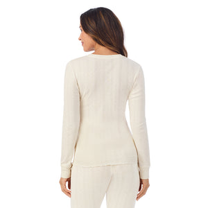 A lady is wearing Cotton Pointelle Long Sleeve Henley
