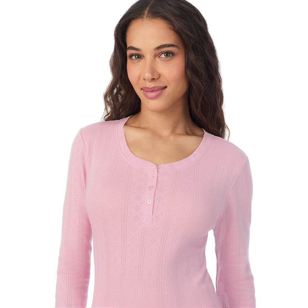 A lady is wearing Cotton Pointelle Long Sleeve Henley

