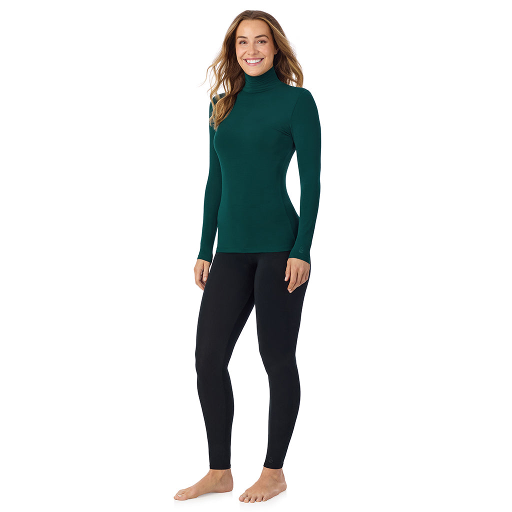 A lady wearing dk pine/navy stripe long sleeve turtleneck softwear with stretch top.